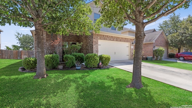 view of front of house with a front yard and a garage