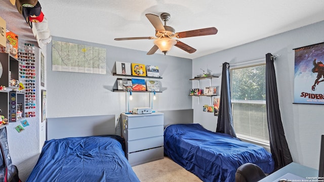 carpeted bedroom with ceiling fan