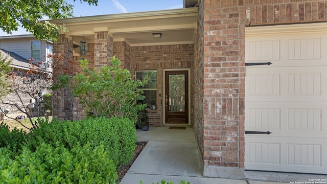 view of exterior entry featuring a garage