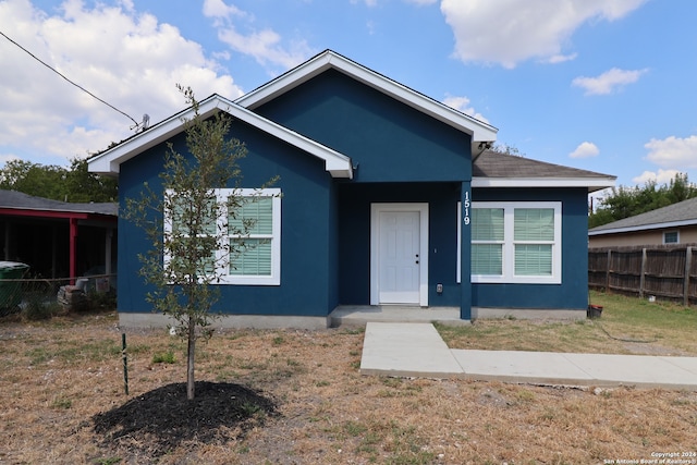 bungalow-style home featuring a front lawn