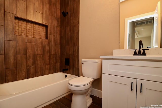 full bath with wood finished floors, vanity, shower / tub combination, toilet, and visible vents