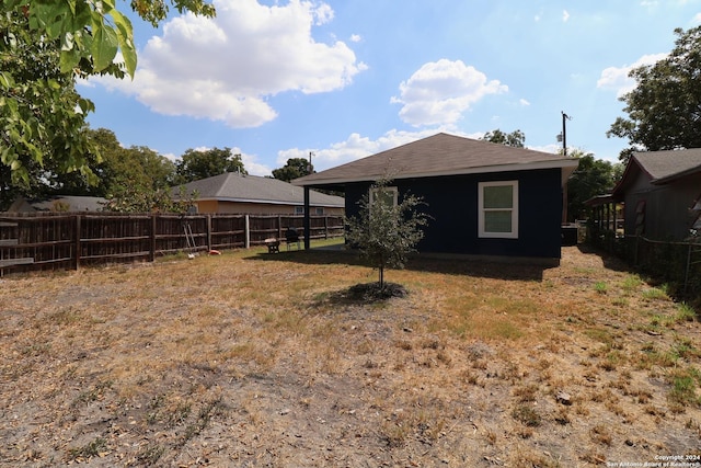 exterior space with a fenced backyard