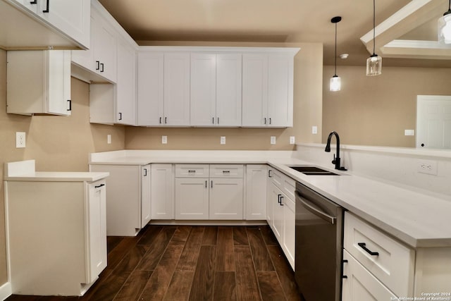 kitchen with dark wood finished floors, stainless steel dishwasher, a sink, pendant lighting, and a peninsula