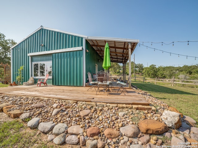 view of outbuilding with a yard