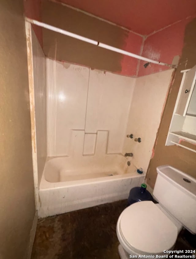 bathroom featuring toilet and shower / washtub combination
