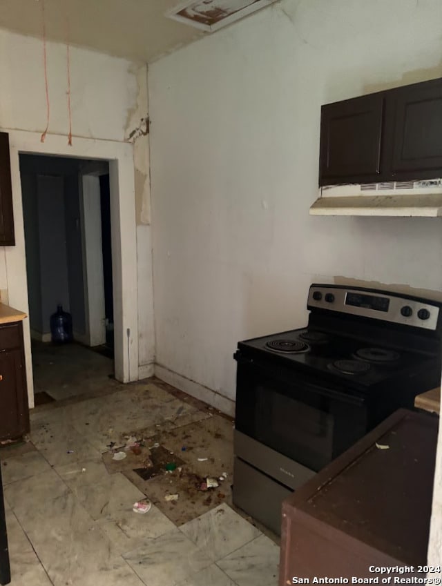 kitchen with under cabinet range hood and stainless steel electric range oven