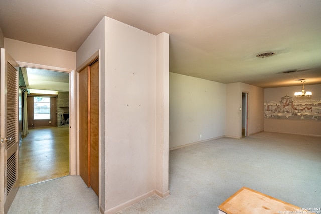 spare room featuring an inviting chandelier