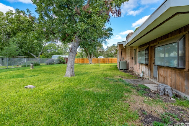 view of yard with central AC