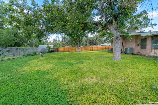 view of yard featuring central AC