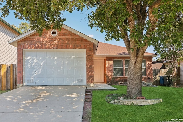 view of front of property featuring a garage and a front lawn