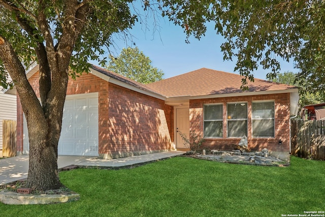 view of front of house featuring a front lawn and a garage