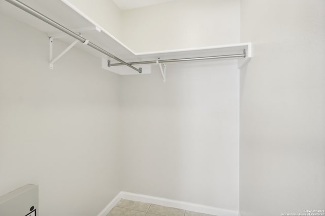 spacious closet featuring light tile patterned flooring