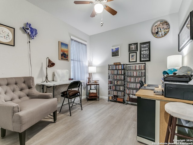 office with ceiling fan and light hardwood / wood-style flooring