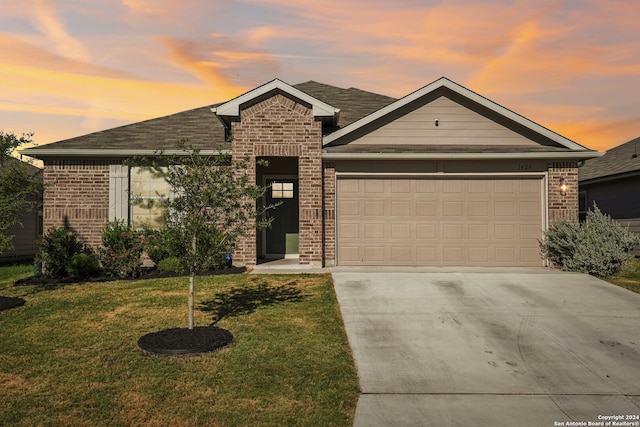 view of front of house with a lawn and a garage