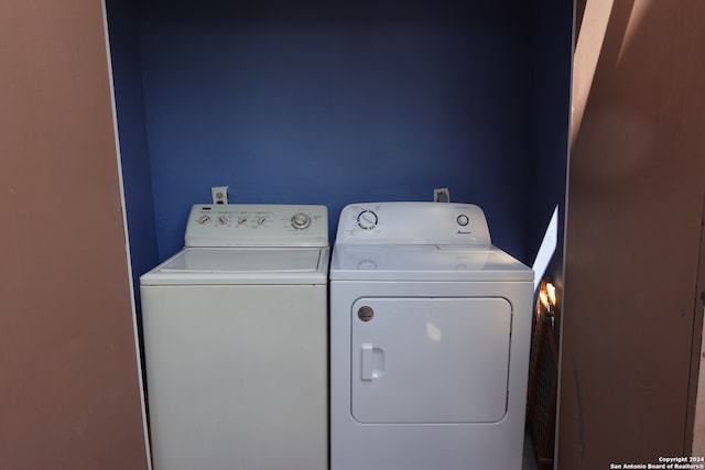 laundry room with washing machine and clothes dryer