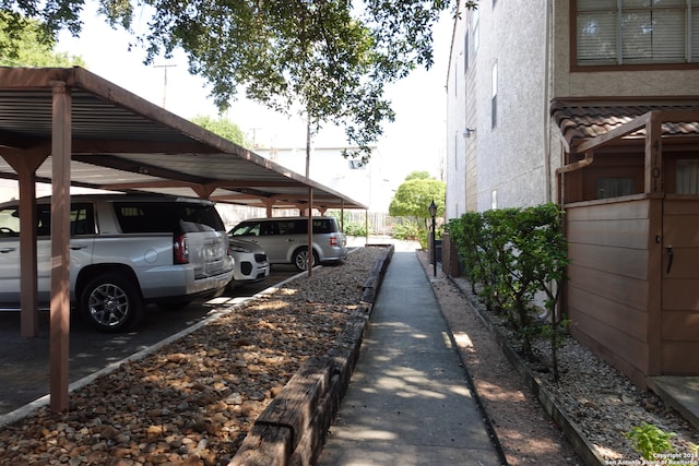 view of parking / parking lot with a carport