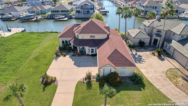 birds eye view of property with a water view