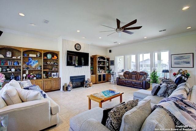 living room with crown molding, a fireplace, and ceiling fan