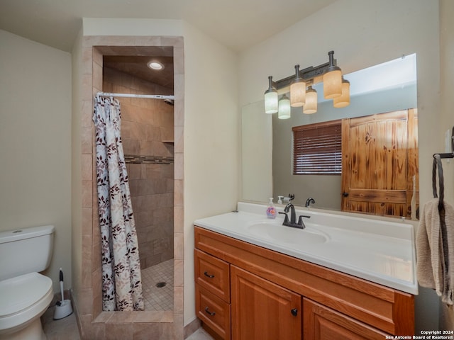 bathroom with a shower with curtain, vanity, and toilet