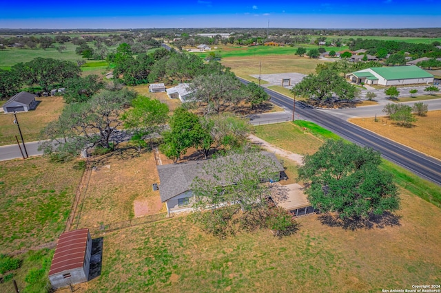 birds eye view of property with a rural view