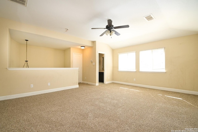 unfurnished room featuring light carpet, ceiling fan, and lofted ceiling