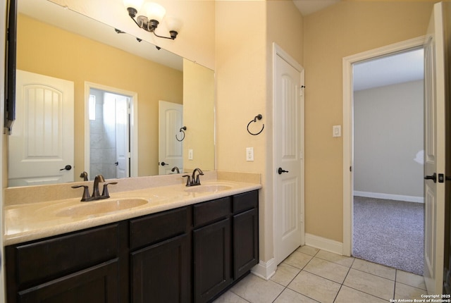 bathroom with tile patterned flooring and vanity