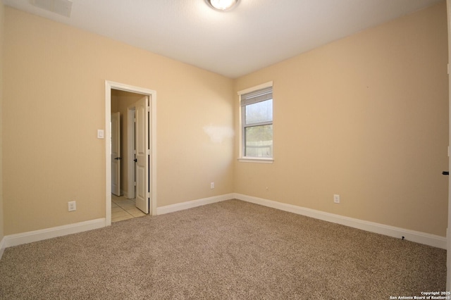 spare room with light carpet