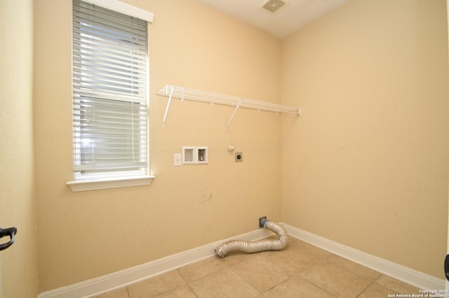 clothes washing area with light tile patterned floors, washer hookup, and hookup for an electric dryer