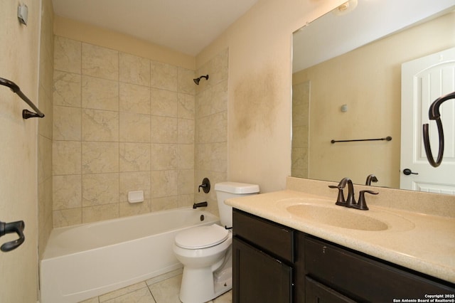 full bathroom with tile patterned flooring, vanity, toilet, and tiled shower / bath