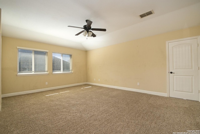 unfurnished room with ceiling fan, carpet, and lofted ceiling