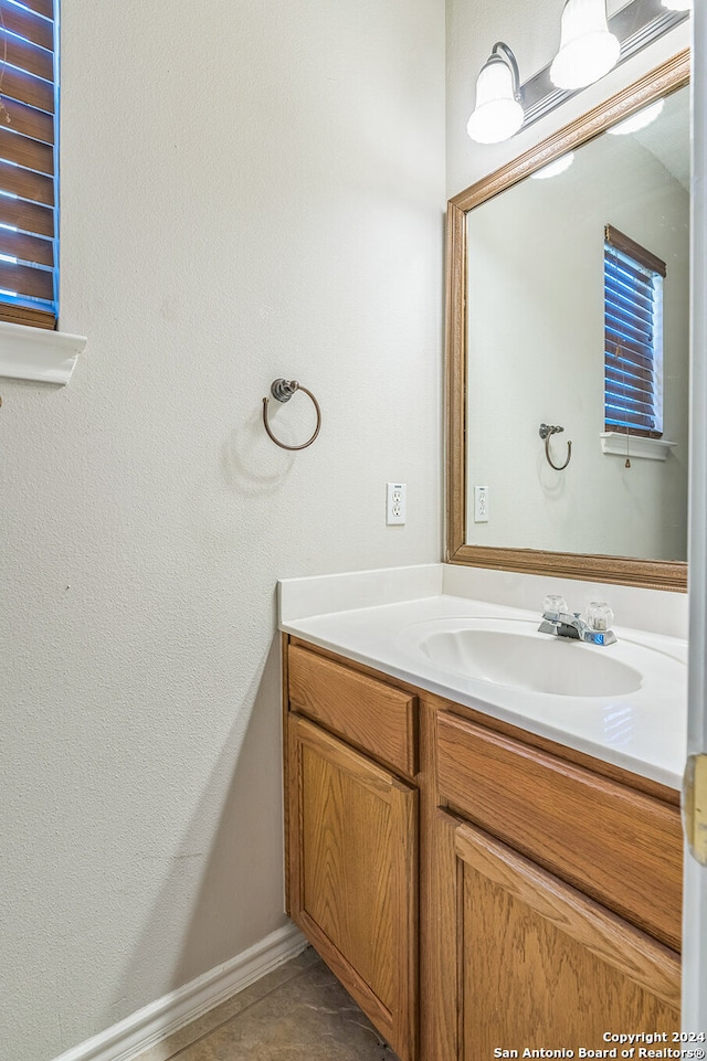 bathroom with vanity and tile patterned floors