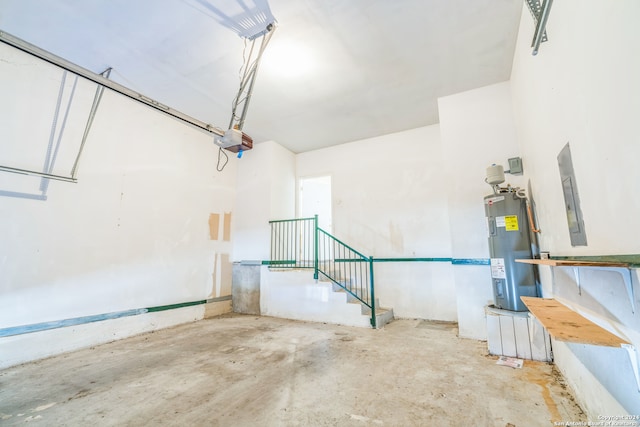 garage with water heater and a garage door opener