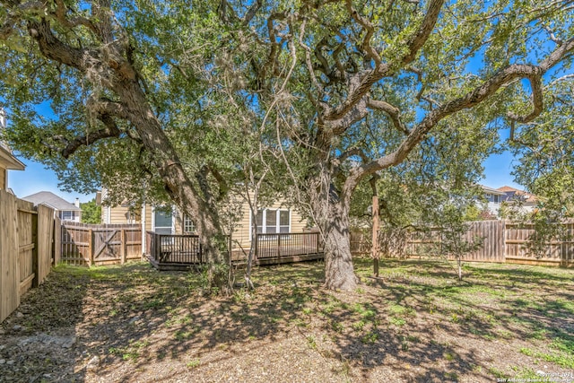 view of yard featuring a wooden deck