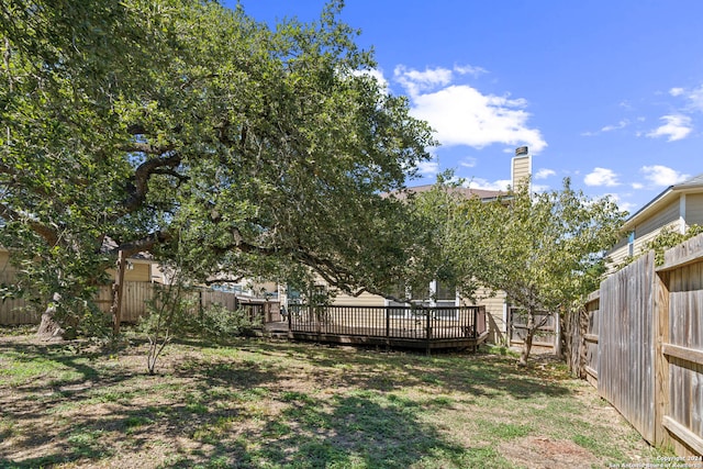 view of yard featuring a wooden deck