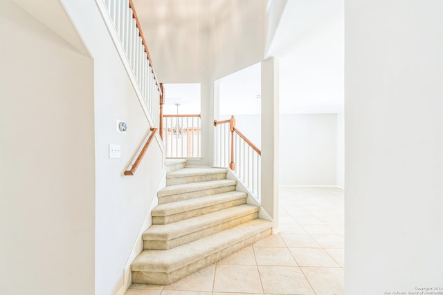 stairs with tile patterned floors