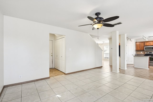 unfurnished living room with ceiling fan and light tile patterned flooring