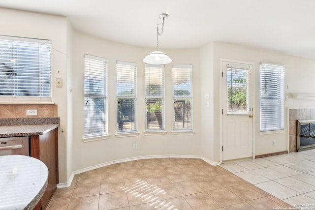 interior space featuring a fireplace and light tile patterned floors