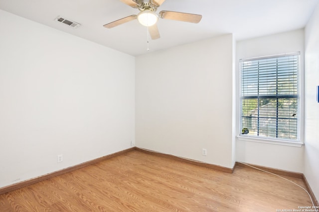 spare room featuring ceiling fan and light wood-type flooring