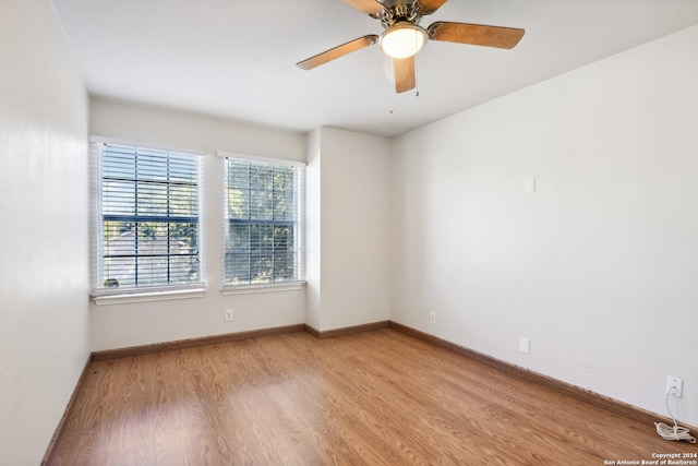 spare room featuring ceiling fan and light hardwood / wood-style floors