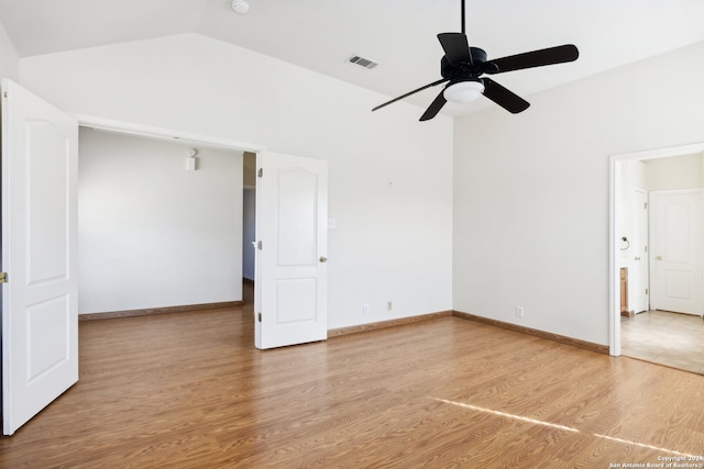 spare room with wood-type flooring, lofted ceiling, and ceiling fan