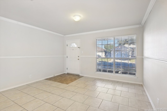 tiled foyer with ornamental molding