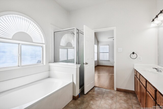 bathroom with vanity, shower with separate bathtub, and tile patterned flooring