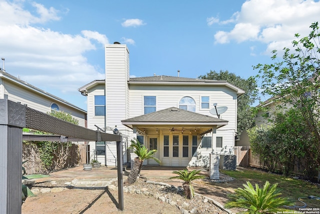 rear view of house with a patio and central air condition unit