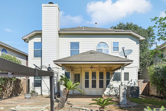 rear view of property with a patio, ceiling fan, and central air condition unit