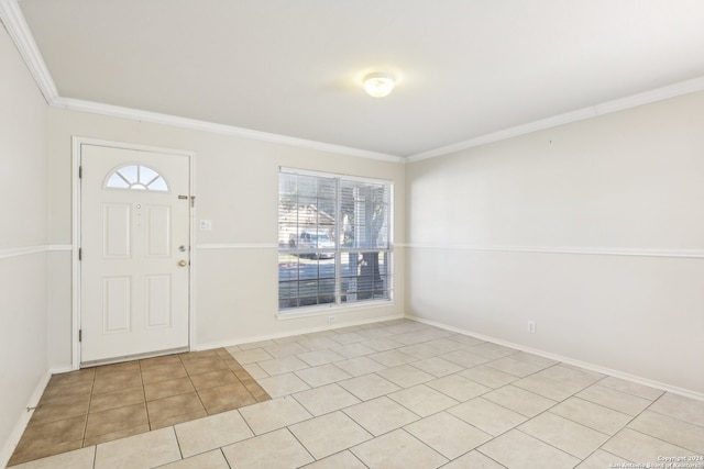 tiled entrance foyer featuring ornamental molding