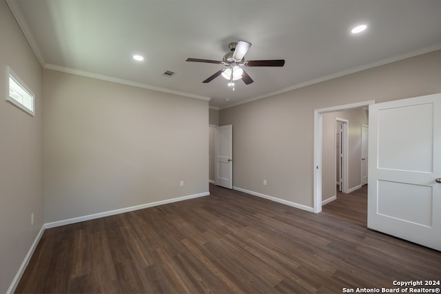 unfurnished bedroom with ornamental molding, ceiling fan, and dark wood-type flooring