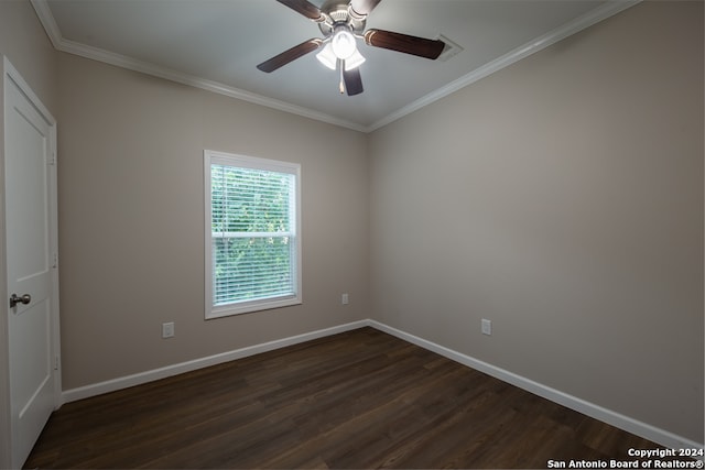 unfurnished room featuring ornamental molding, dark hardwood / wood-style floors, and ceiling fan