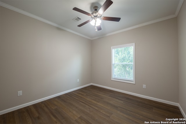 unfurnished room with ceiling fan, dark wood-type flooring, and crown molding