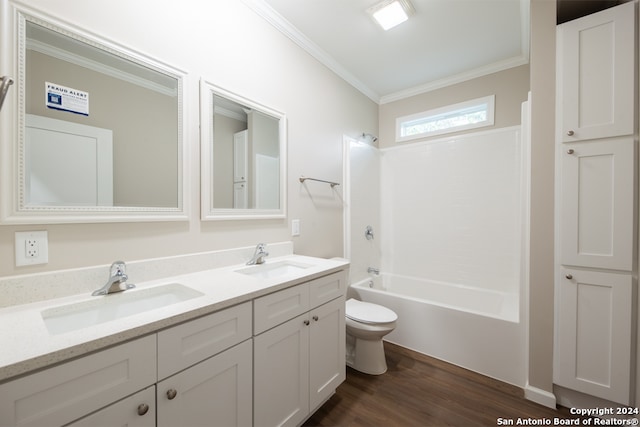 full bathroom featuring vanity, toilet, tub / shower combination, crown molding, and hardwood / wood-style floors