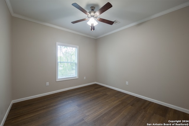 unfurnished room with ornamental molding, ceiling fan, and dark hardwood / wood-style flooring